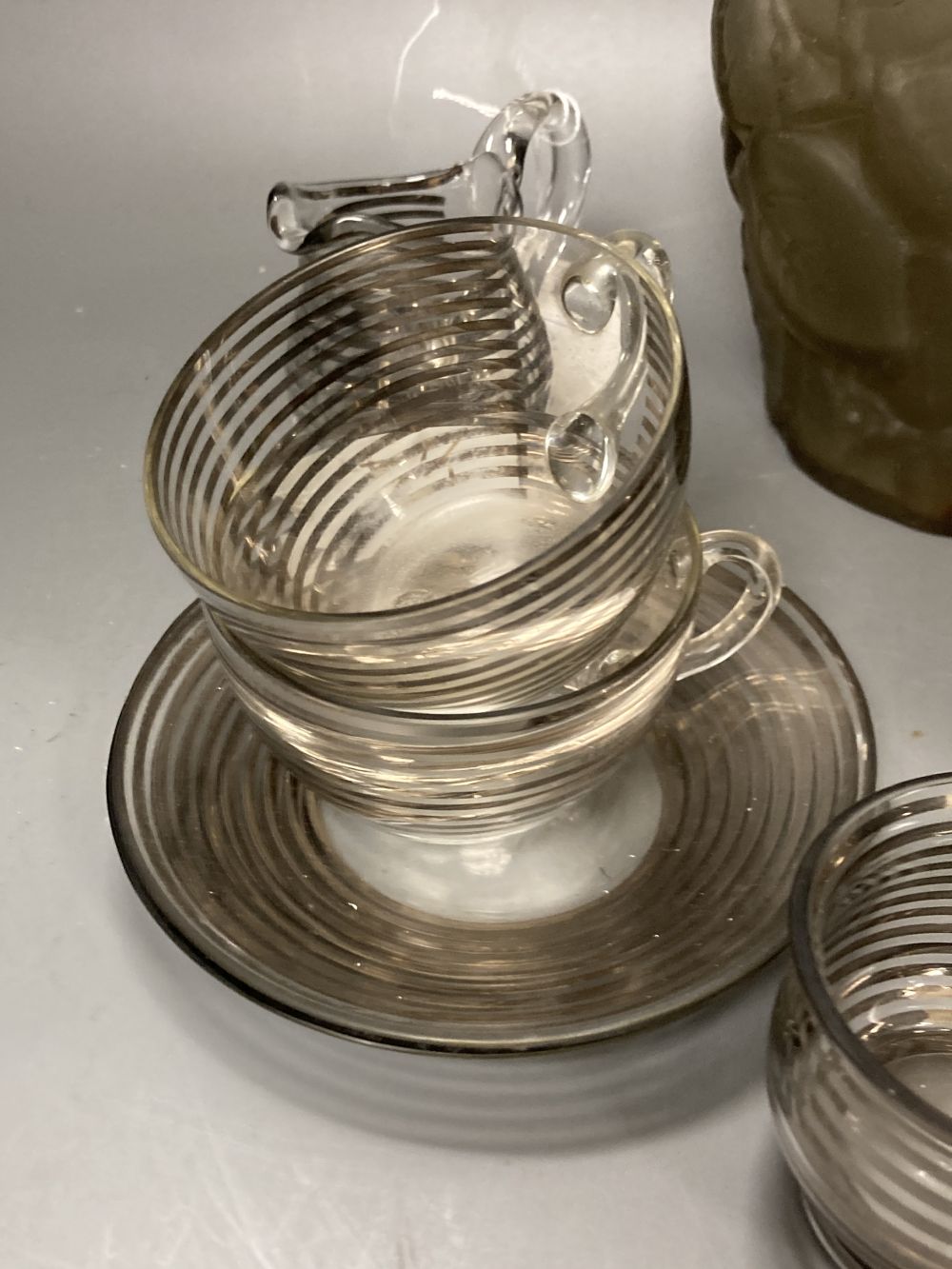 An Art Deco silver stripe and glass tea for two and a frosted leaf design vase, 23.5cm